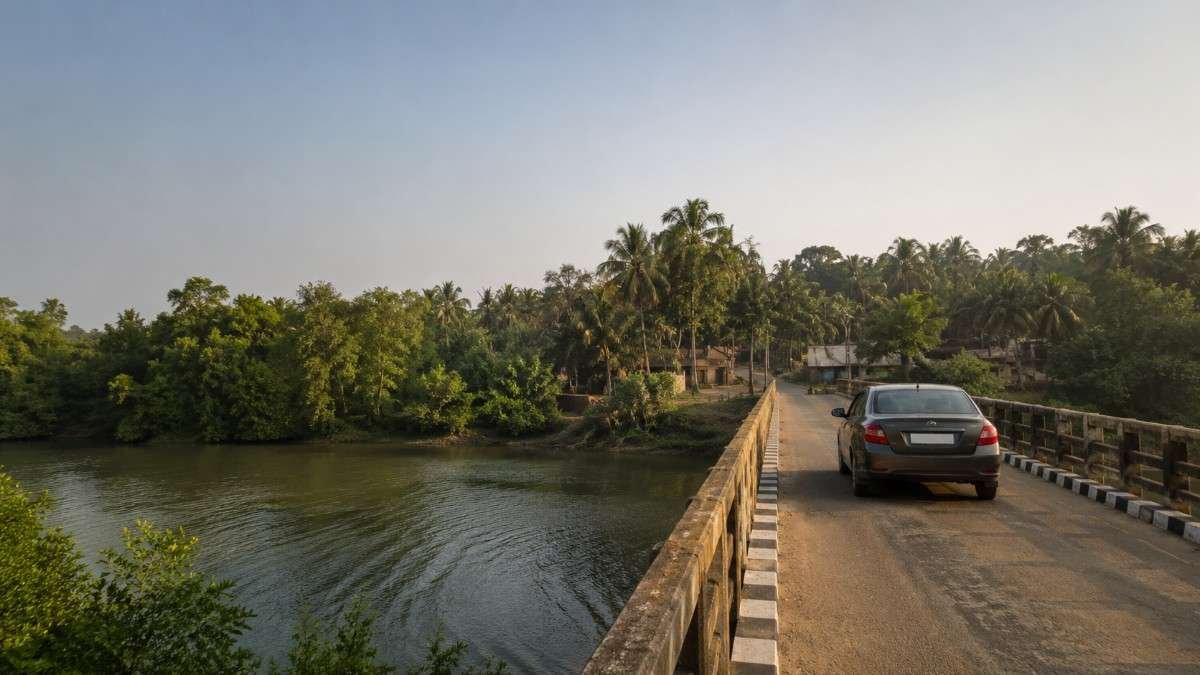 Car crossing the bridge over the Brahmani river on the Kendrapara to Bhitarkanika route